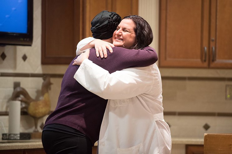 cancer patient hugging doctor