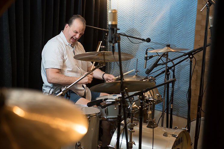 throat cancer patient bob livernois playing drums