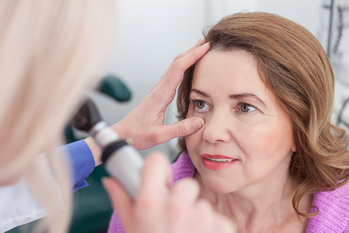 Woman getting eye exam