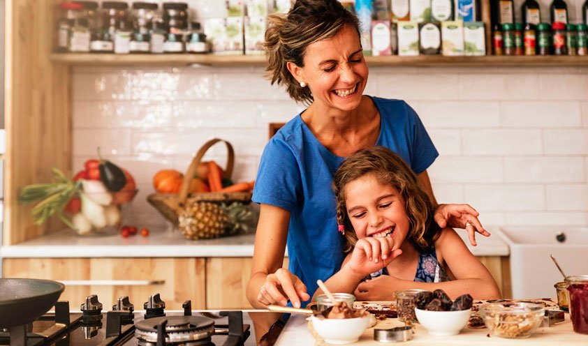 mother and daughter cooking together