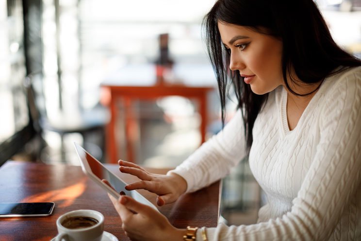 woman reading ipad