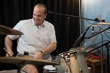 bob livernois head and neck cancer patient playing drums
