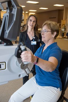 rehab patient using ergonomic machine