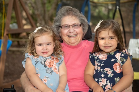 Laura ALS patient with granddaughters