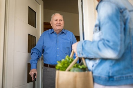 Man receiving grocery delivery