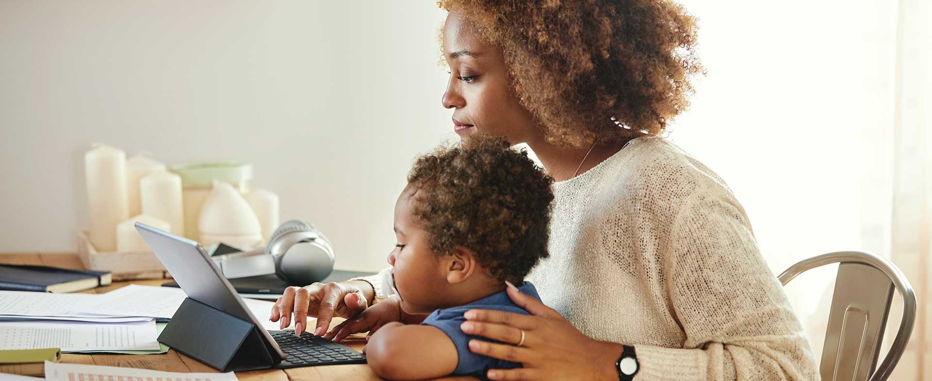 Mother and son on laptop