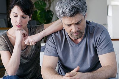 concerned looking couple