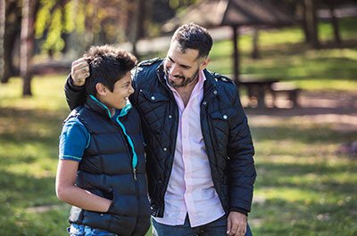 father and son in the park together