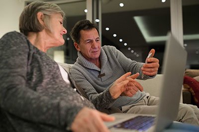 older couple looking at a computer