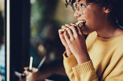 woman eating sandwich