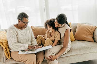 family sitting on couch