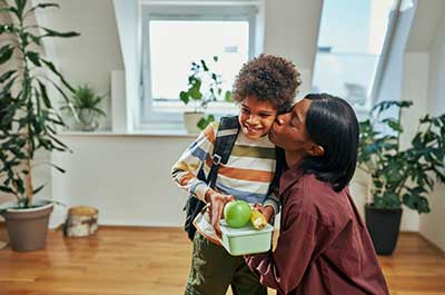 mother sending child to school