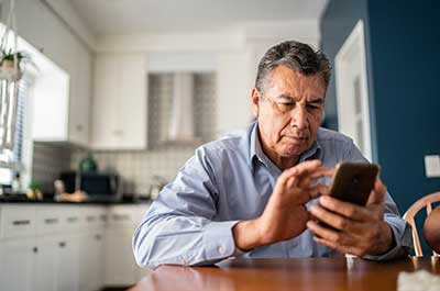man reading on phone