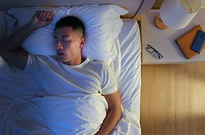 man snoring while sleeping