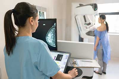 woman getting mammogram