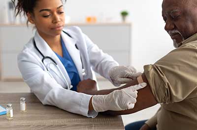 man getting vaccination