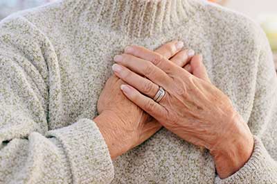 older woman with acid reflux