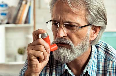 man using inhaler