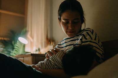 mom breastfeeding baby