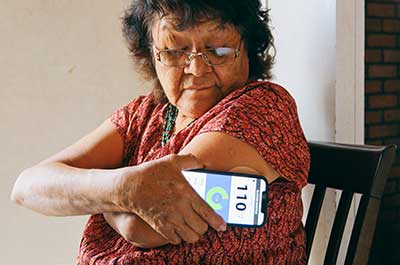 woman checking blood sugar