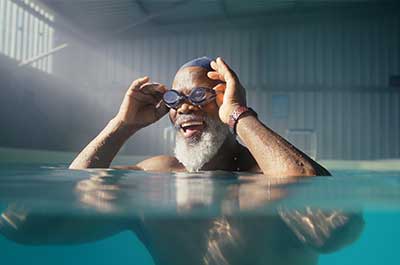 man putting on goggles