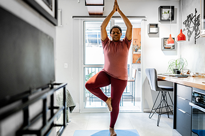 woman stretching at home