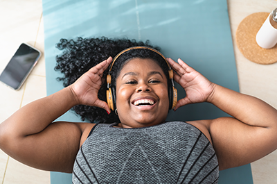 woman listening to music on headphones