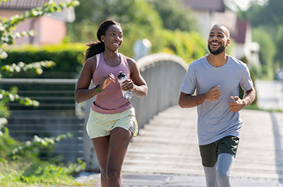 two friends running outside