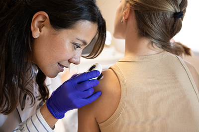 dermatologist doing skin check