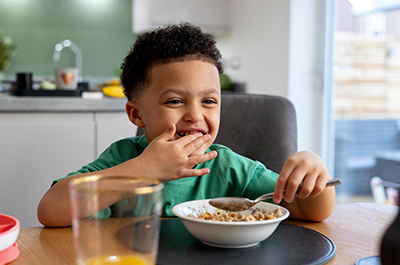 little boy eating cereal