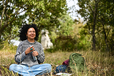 woman sitting outside smiling