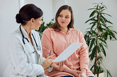 female patient talking to doctor