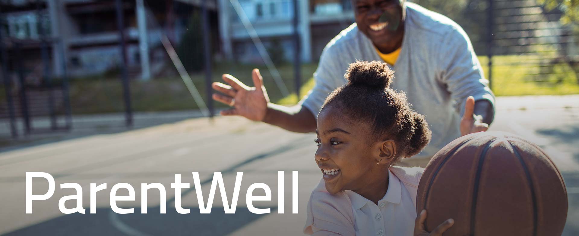 dad holding tolder son