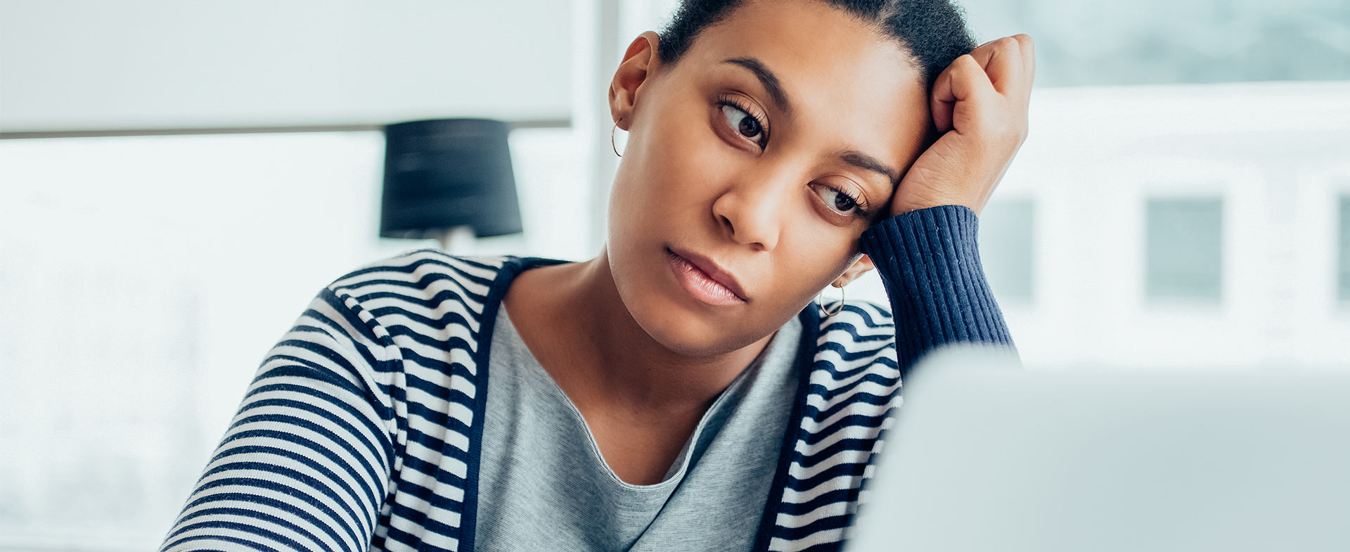 tired woman at computer