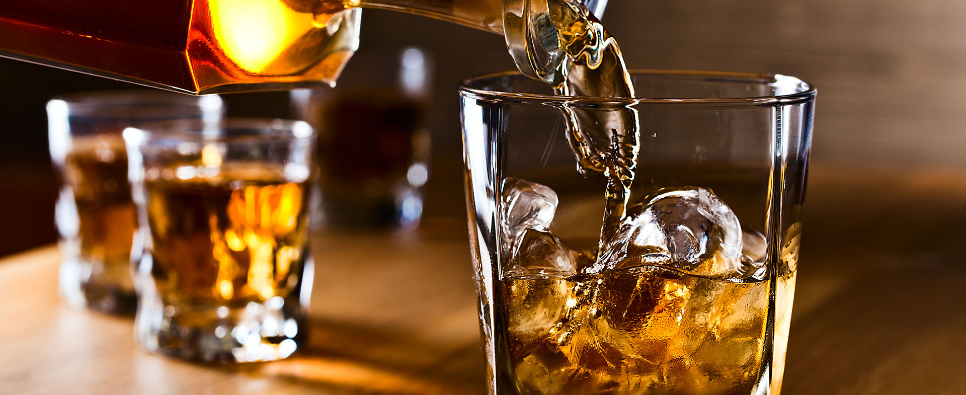 someone pouring whiskey