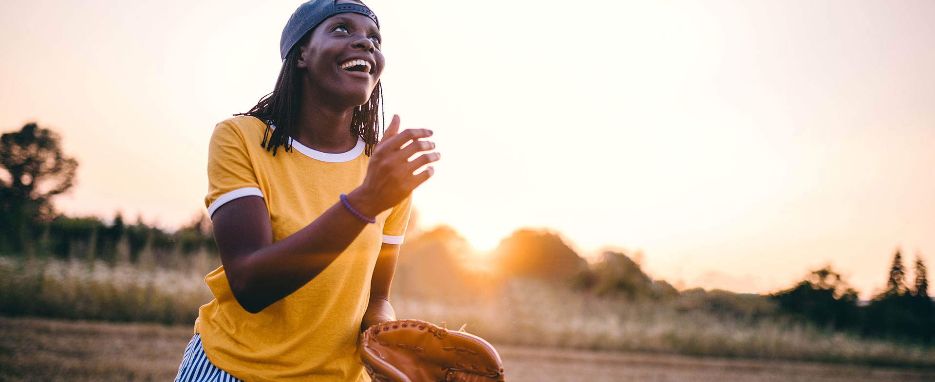 woman playing baseball