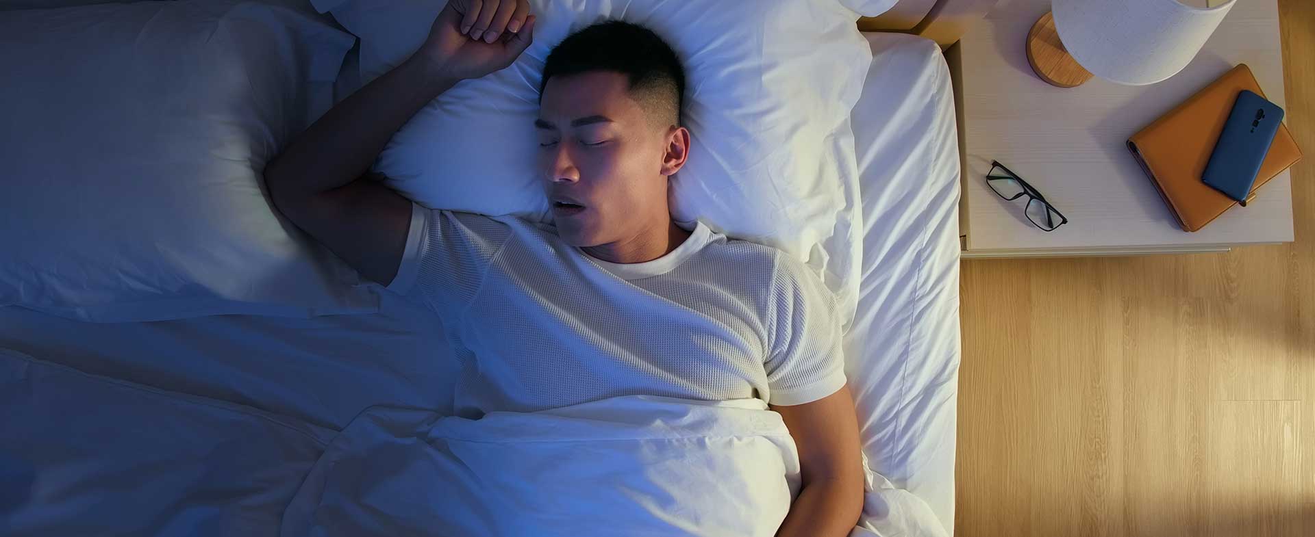 man snoring while sleeping