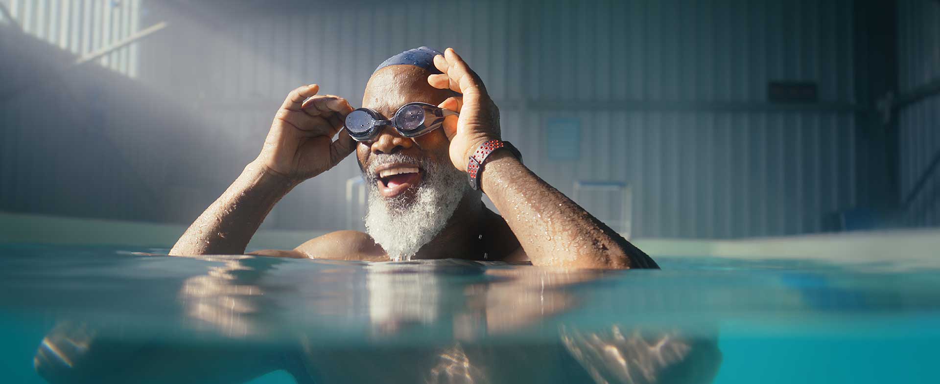 man putting on goggles