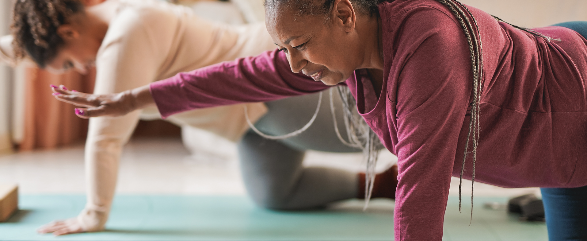 women practicing yoga