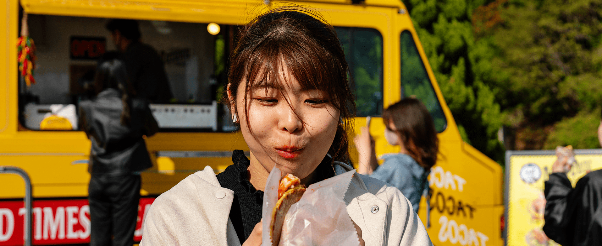 woman eating taco