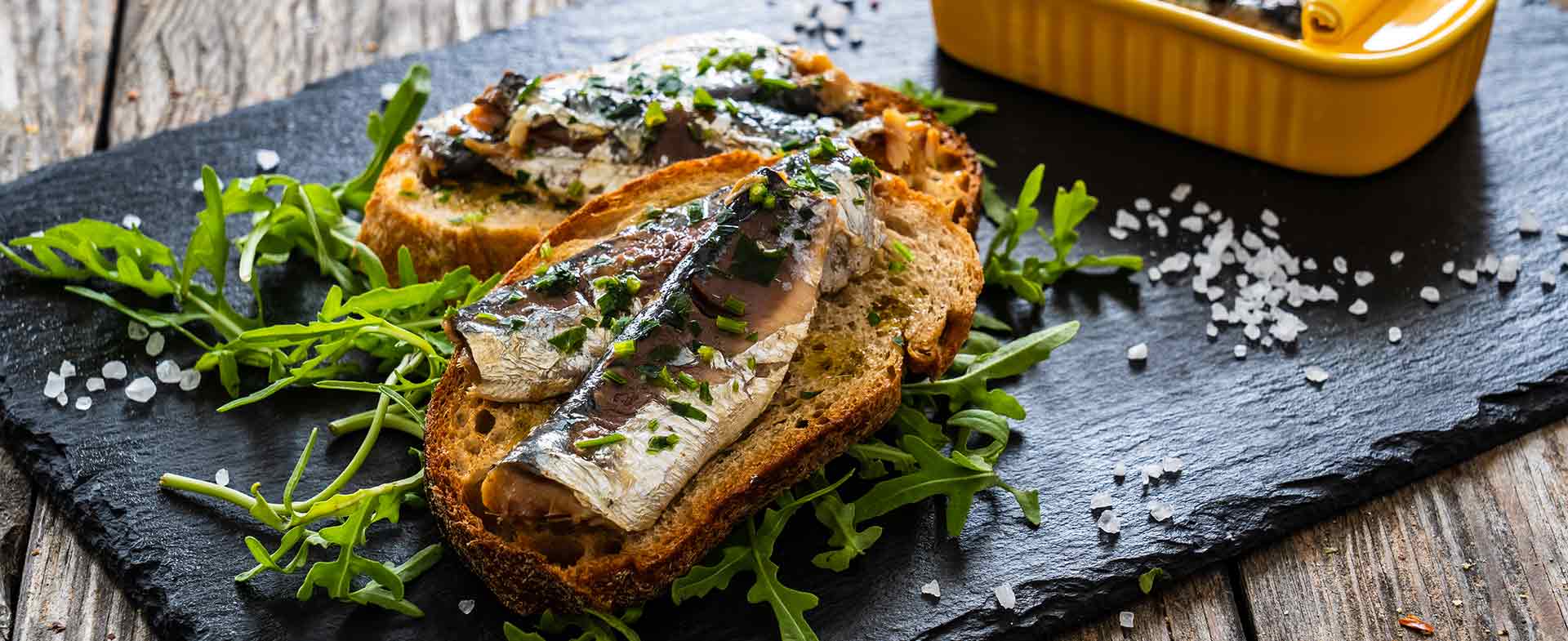 Canned sardines on toast with herbs and arugula sardines superfood
