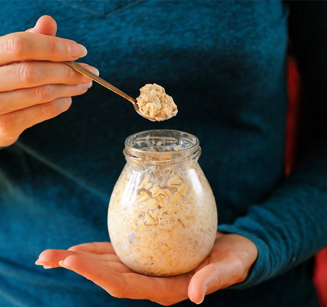 eating overnight oats from a jar
