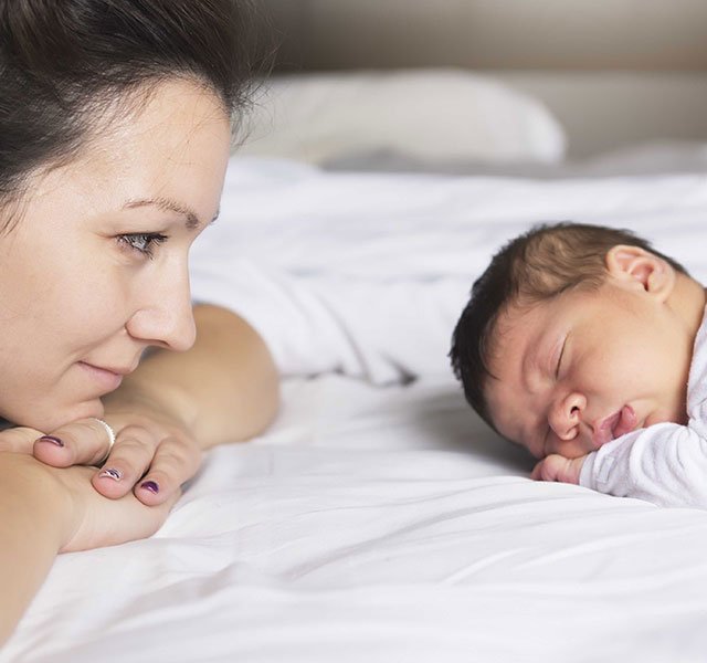 mom looking at baby