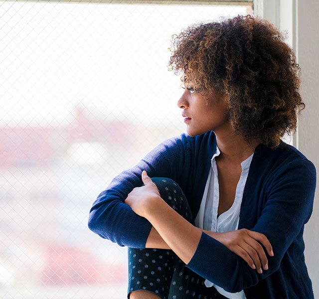 Woman looking out the window