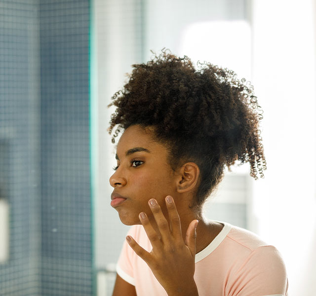 girl looking in mirror