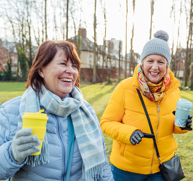 women walking and talking
