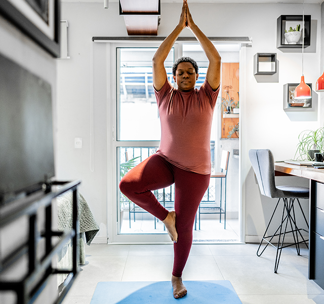 woman stretching at home