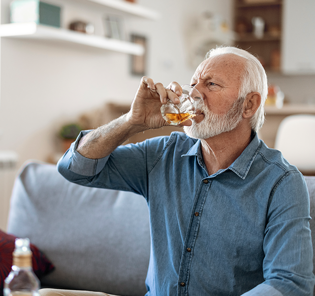 man drinking alcohol