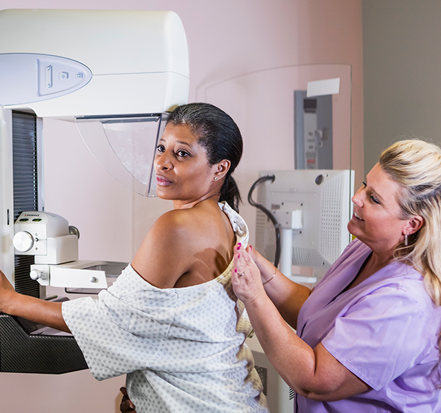 woman getting mammogram