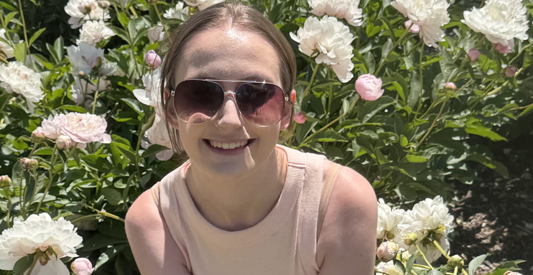 Patient Isabella in a flower field